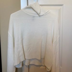 Cropped white turtleneck sweater